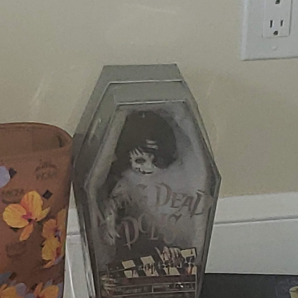 Sealed living dead dolls x 2